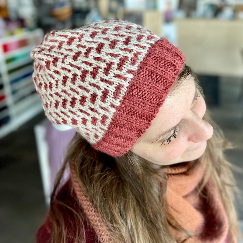 Person wearing a patterned knit Tincture hat by Andrea Mowry